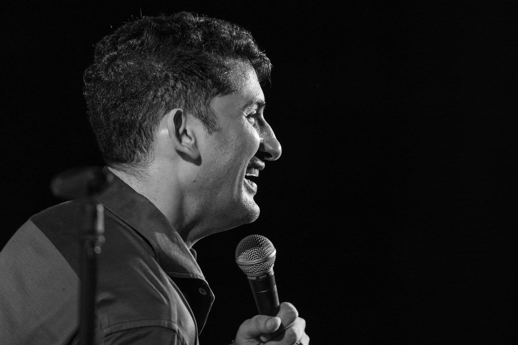 Danish Sait laughing into the microphone